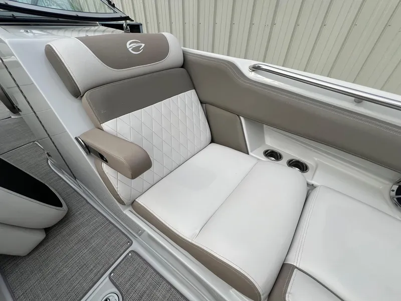 Slide: The Image of 2019 Crownline Eclipse E285 boat interior seating with cup holders. - 14