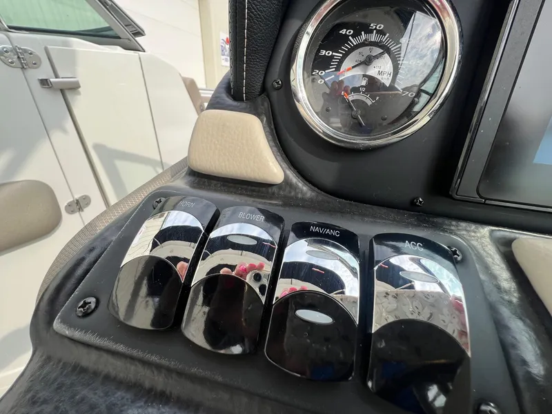 Slide: The Image of Dashboard controls of 2019 Crownline Eclipse E285 boat with speedometer and switches. - 20