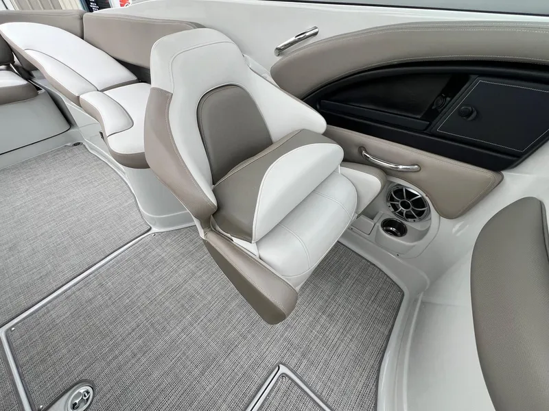 Slide: The Image of 2019 Crownline Eclipse E285 boat interior with plush seating and modern design. - 24