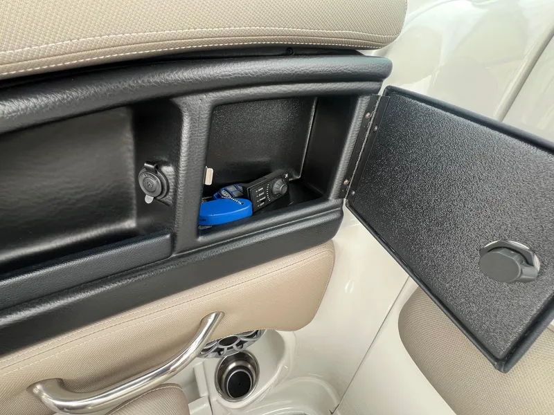 Slide: The Image of 2019 Crownline Eclipse E285 storage compartment with accessories inside. - 27