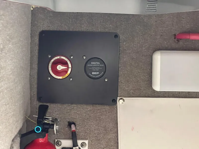 Slide: The Image of 2019 Crownline Eclipse E285 boat control panel with fire extinguisher and digital voltage display. - 29