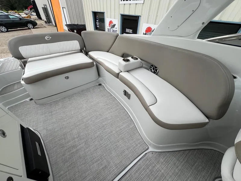 Slide: The Image of 2019 Crownline Eclipse E285 boat interior with beige and white seating. - 31
