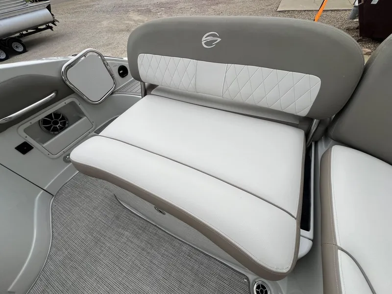 Slide: The Image of 2019 Crownline Eclipse E285 boat interior seating with elegant upholstery and speaker system. - 38