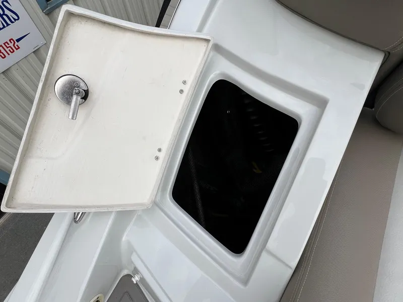 Slide: The Image of Open storage compartment on 2019 Crownline Eclipse E285 boat. - 45