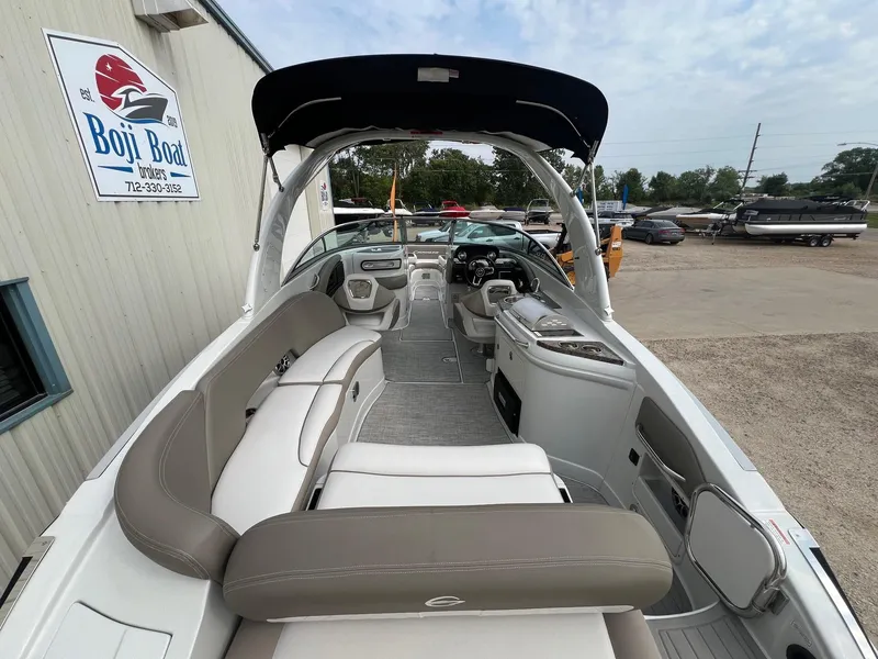 Slide: The Image of 2019 Crownline Eclipse E285 boat interior with seating and helm, displayed at Boji Boat Brokers. - 9