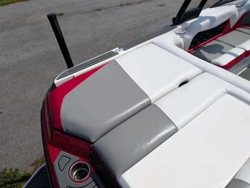 Slide: The Image of 2014 Moomba Mondo boat interior with red, gray, and white seating. - 12