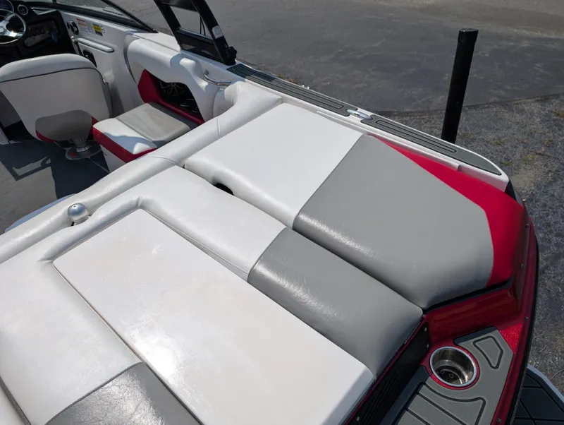 Slide: The Image of 2014 Moomba Mondo boat interior with red, gray, and white seating. - 13