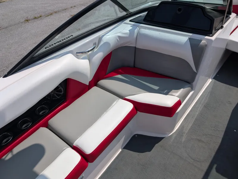 Slide: The Image of 2014 Moomba Mondo boat interior with red and gray seating, sleek design. - 14