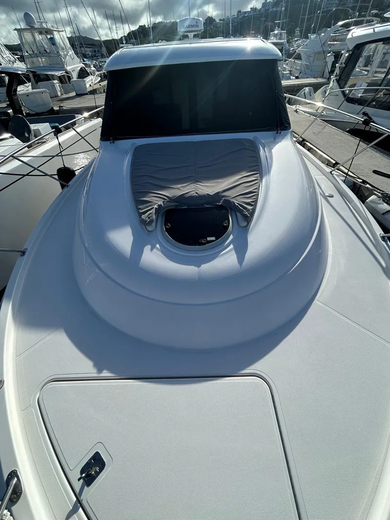 Slide: The Image of 2022 Tiara Yachts C39 Coupe, sleek design, docked in marina. - 3