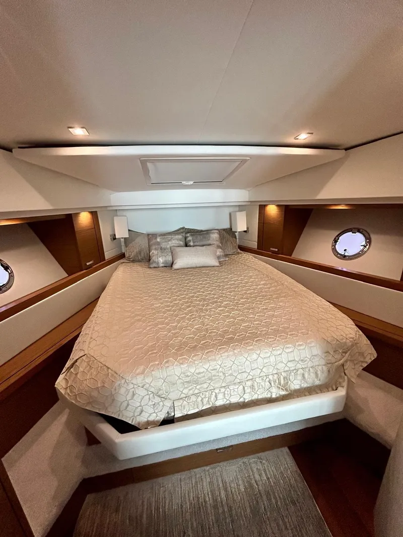 Slide: The Image of Luxurious cabin interior of 2022 Tiara Yachts C39 Coupe with elegant bedding. - 8