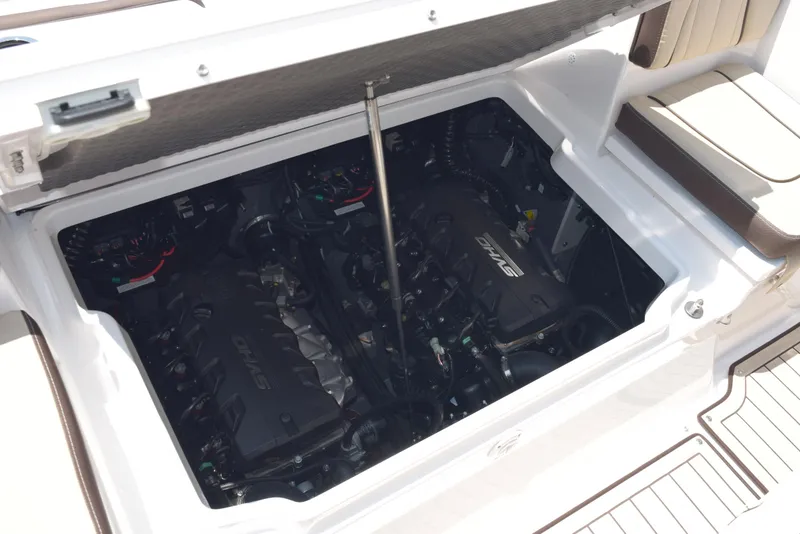 Slide: The Image of 2025 Yamaha Boats 255 FSH Sport E engine compartment, showcasing dual engines and interior design. - 19