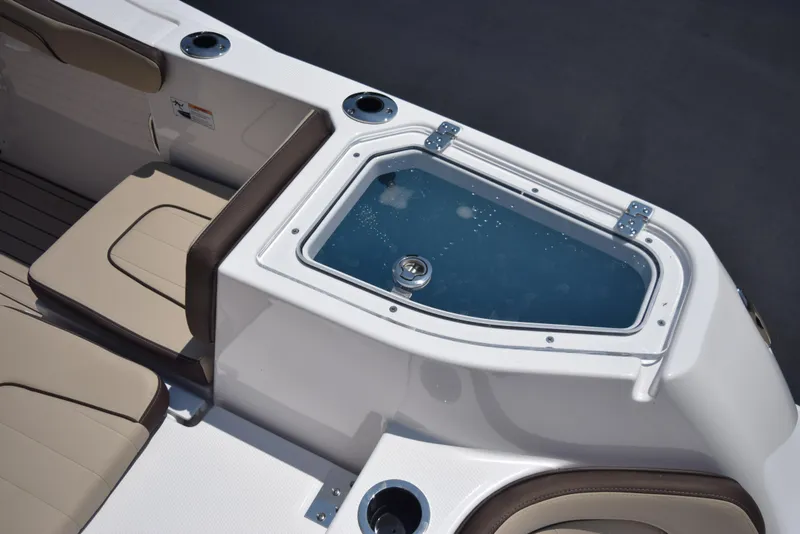 Slide: The Image of 2025 Yamaha Boats 255 FSH Sport E interior with seating and livewell. - 6