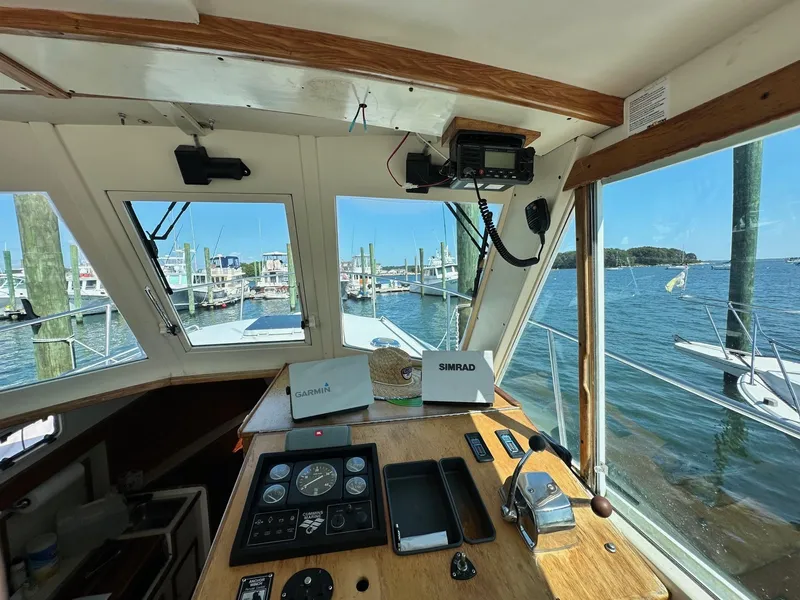 Slide: The Image of Interior view of 1998 Mast & Mallet Rabbit 34 boat cockpit with navigation equipment. - 12