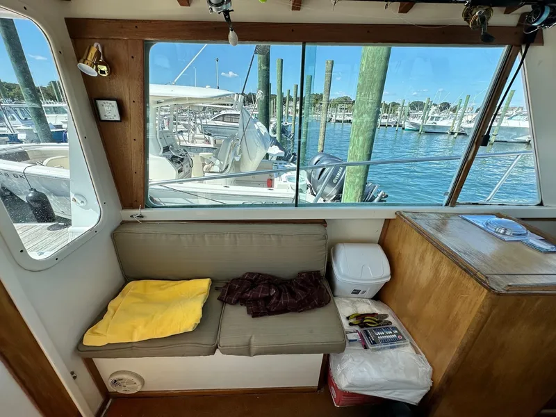 Slide: The Image of Interior of 1998 Mast & Mallet Rabbit 34 boat with marina view through window. - 13