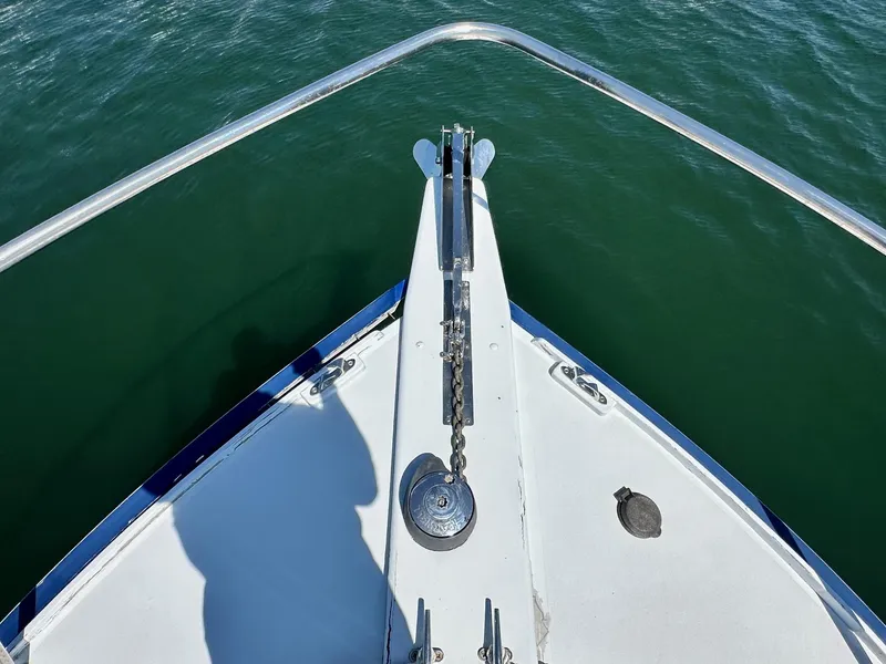 Slide: The Image of Bow of 1998 Mast & Mallet Rabbit 34 boat on water. - 5