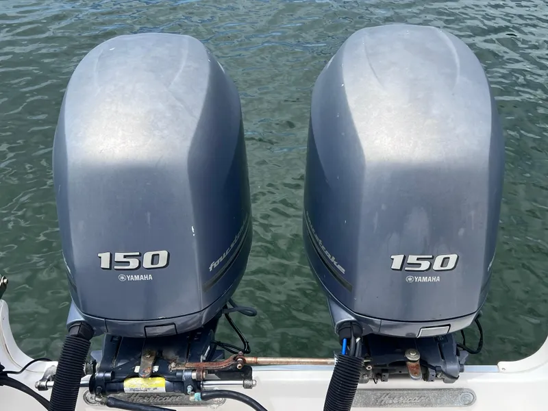 Slide: The Image of Twin Yamaha 150 outboard motors on a 2006 Hurricane SunDeck 260 OB boat. - 10
