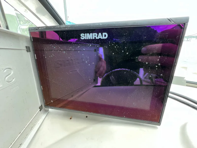 Slide: The Image of Simrad marine display on 2006 Hurricane SunDeck 260 OB, reflecting surroundings. - 14