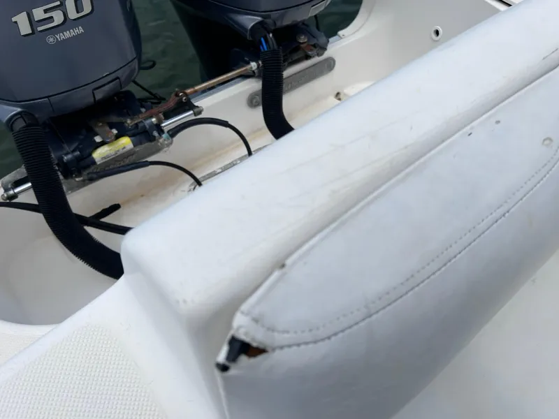 Slide: The Image of 2006 Hurricane SunDeck 260 OB with twin Yamaha 150 engines, showing boat seating detail. - 17