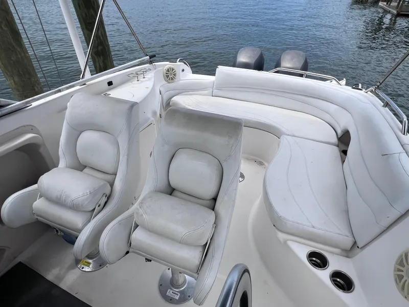 Slide: The Image of 2006 Hurricane SunDeck 260 OB boat interior with white seating and twin Yamaha 150 engines. - 5