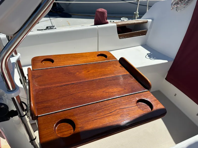 Slide: The Image of Polished wooden table on 1988 Catalina 30 sailboat deck. - 18