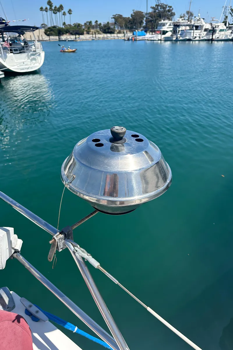 Slide: The Image of Stainless steel grill on a 1988 Catalina 30 sailboat, docked in a marina. - 19