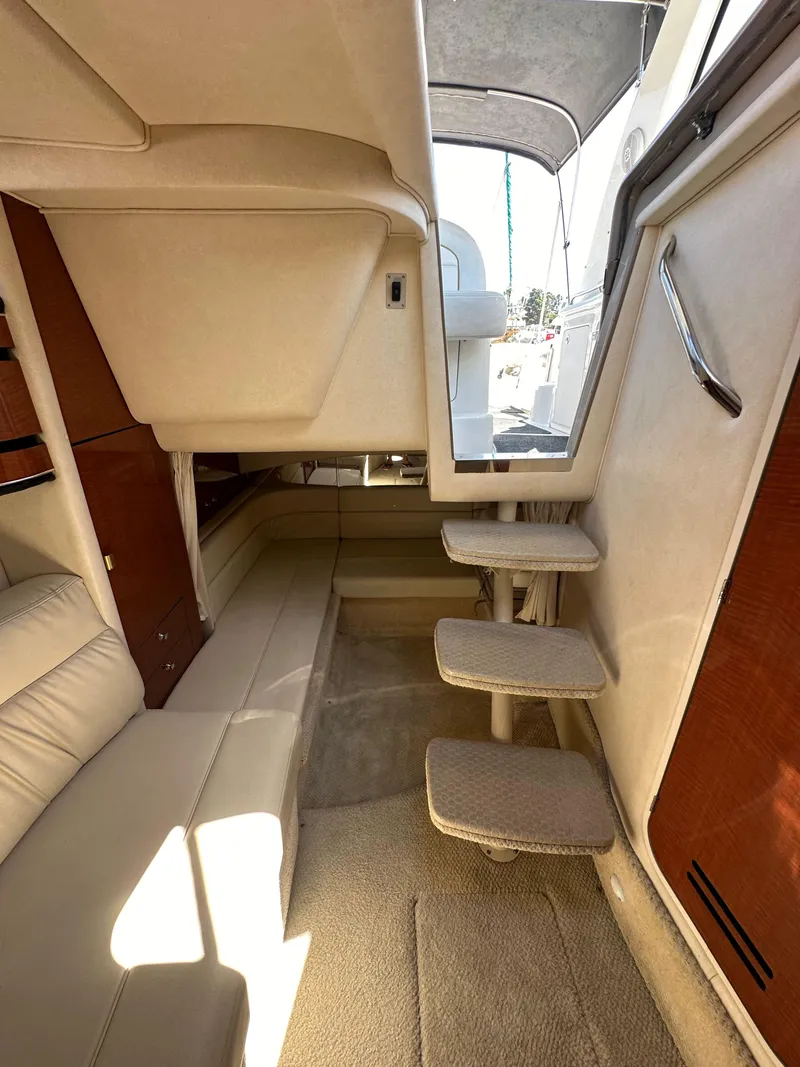 Slide: The Image of Interior of 2003 Sea Ray SUNDANCER 300 yacht, featuring steps and seating area. - 29