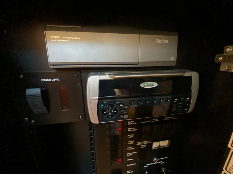 Slide: The Image of Control panel of 2003 Sea and Secure SUNDANCER 300 with Clarion stereo system. - 36