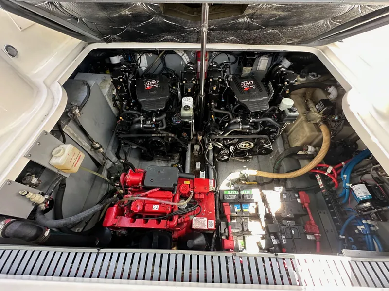 Slide: The Image of Engine compartment of a 2003 Sea Ray SUNDANCER 300 boat, showcasing dual engines and components. - 37