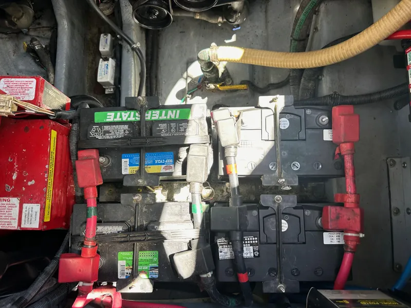 Slide: The Image of Battery compartment of a 2003 Sea Ray SUNDANCER 300 boat, showing wiring and connections. - 39