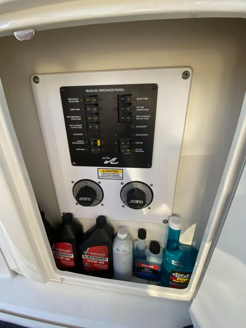 Slide: The Image of Control panel of 2003 Sea Ray SUNDANCER 300 with maintenance supplies. - 43