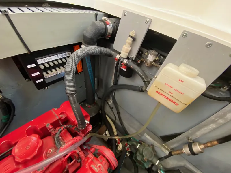 Slide: The Image of Engine compartment of a 2003 Sea Ray SUNDANCER 300 boat, showing mechanical components. - 46