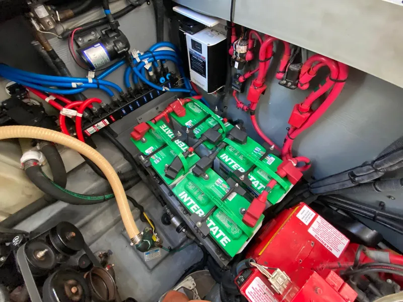 Slide: The Image of Engine compartment of 2003 Sea Ray SUNDANCER 300 with Interstate batteries and wiring. - 48