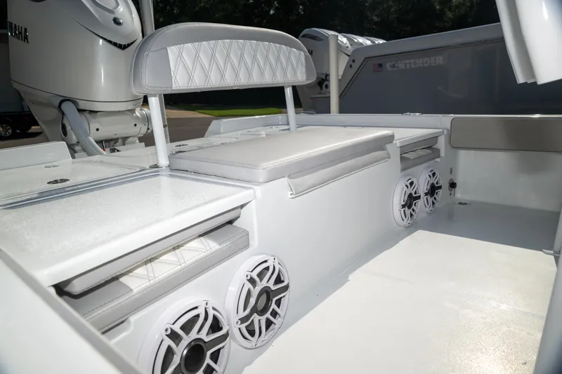 Slide: The Image of 2025 Contender 26 Bay boat interior with seating and speakers, showcasing modern design. - 13