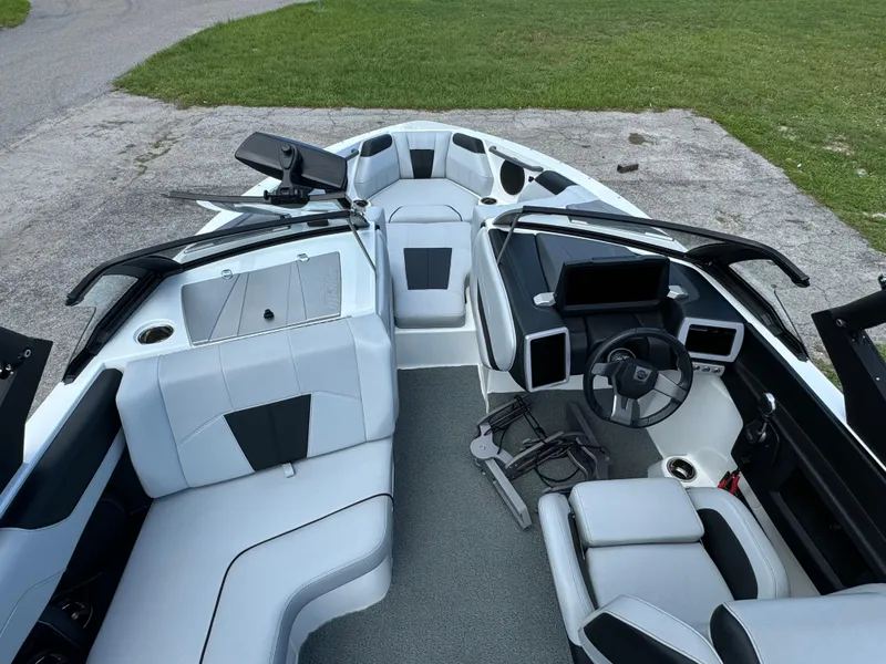 Slide: The Image of 2022 Malibu Wakesetter 20 VTX interior with modern dashboard and seating. - 17