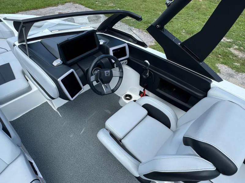 Slide: The Image of 2022 Malibu Wakesetter 20 VTX boat interior with modern dashboard and seating. - 18