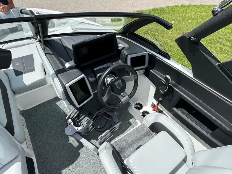 Slide: The Image of 2022 Malibu Wakesetter 20 VTX boat interior with modern dashboard and steering wheel. - 19