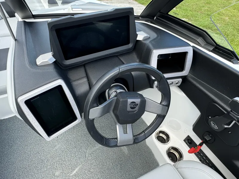 Slide: The Image of 2022 Malibu Wakesetter 20 VTX dashboard with modern steering and digital displays. - 20