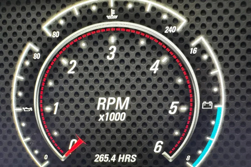Slide: The Image of 2022 Malibu Wakesetter 20 VTX tachometer displaying 265.4 hours and RPM gauge. - 22