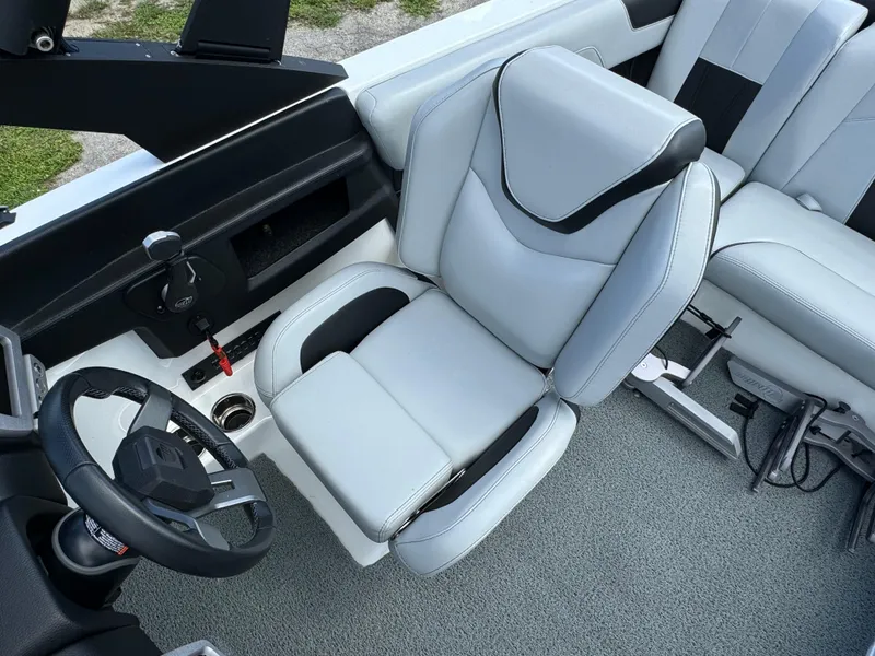 Slide: The Image of 2022 Malibu Wakesetter 20 VTX interior with sleek, modern seating and steering wheel. - 23