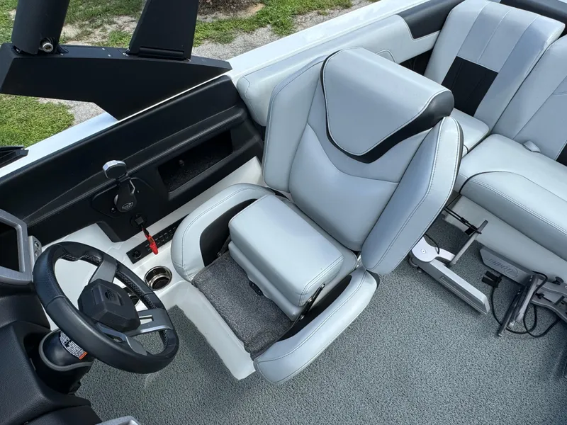 Slide: The Image of 2022 Malibu Wakesetter 20 VTX interior with sleek gray seating and modern dashboard. - 24