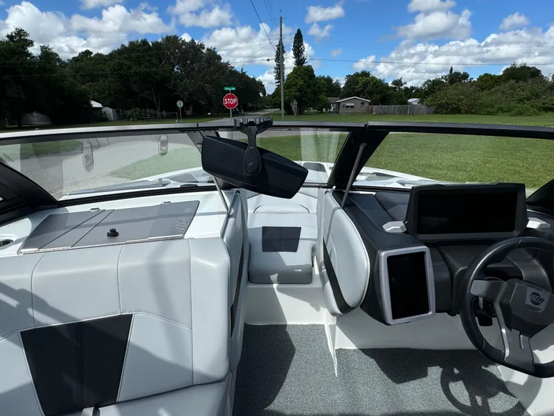 Slide: The Image of 2022 Malibu Wakesetter 20 VTX interior with modern dashboard and seating. - 27