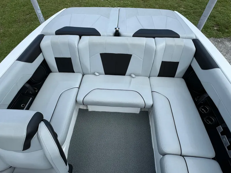 Slide: The Image of 2022 Malibu Wakesetter 20 VTX interior with sleek white and black seating. - 33