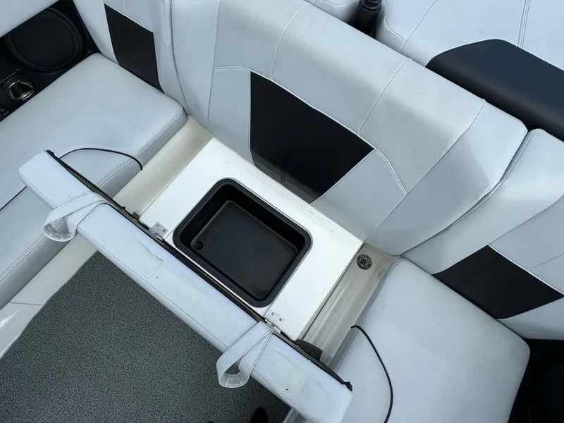 Slide: The Image of 2022 Malibu Wakesetter 20 VTX interior seating with storage compartment. - 35