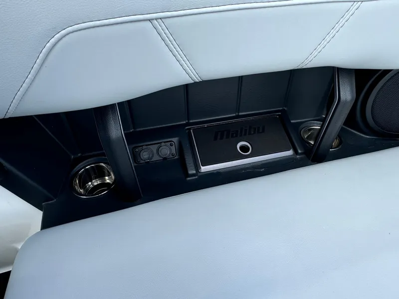 Slide: The Image of Interior of 2022 Malibu Wakesetter 20 VTX boat with cup holders and speaker. - 38