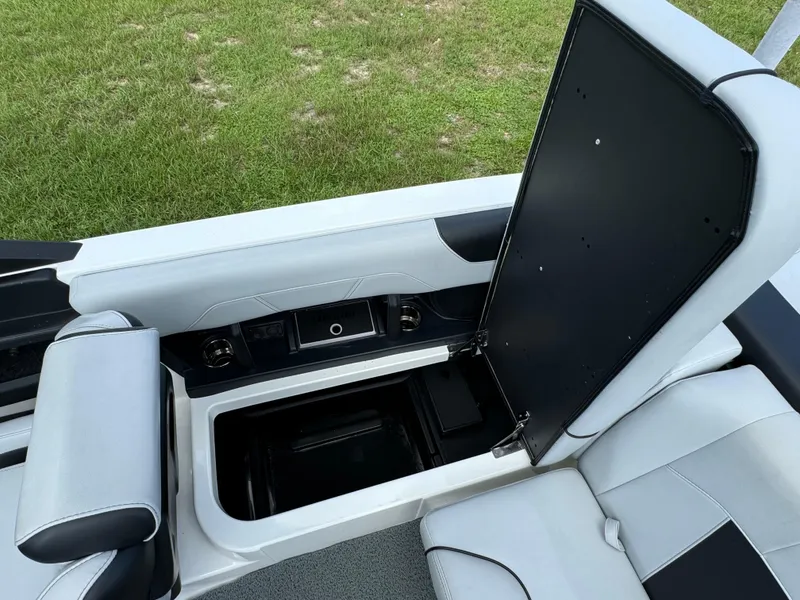 Slide: The Image of 2022 Malibu Wakesetter 20 VTX interior storage compartment open, showcasing sleek design. - 39