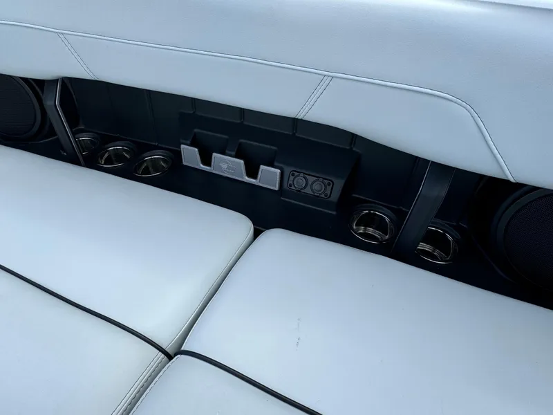 Slide: The Image of 2022 Malibu Wakesetter 20 VTX interior seating with cup holders and speakers. - 42