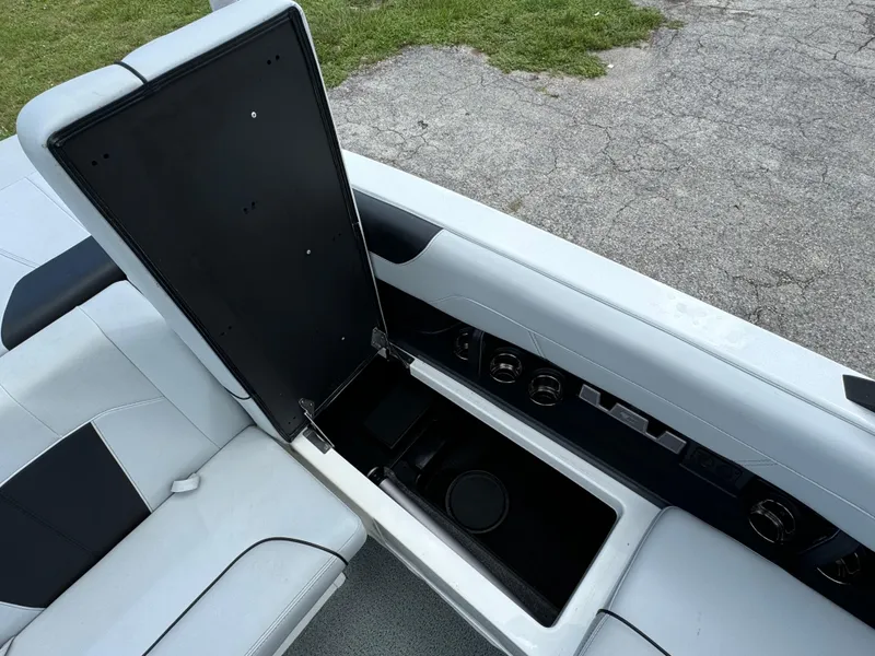 Slide: The Image of 2022 Malibu Wakesetter 20 VTX interior storage compartment open, showcasing sleek design. - 43
