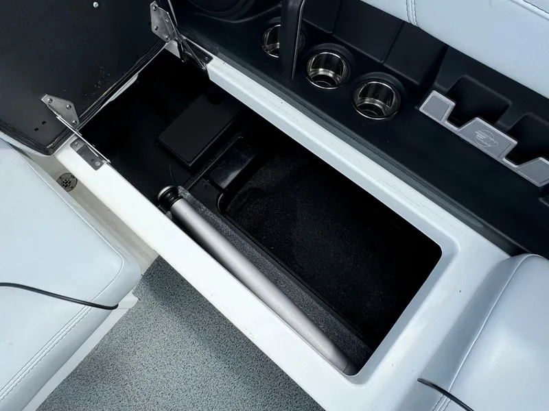 Slide: The Image of 2022 Malibu Wakesetter 20 VTX interior storage compartment with cup holders and sleek design. - 44