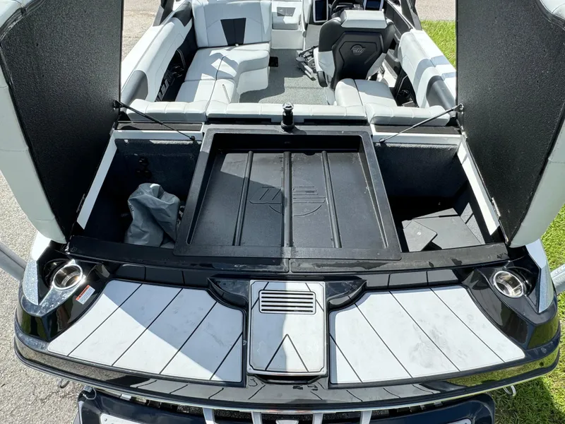 Slide: The Image of 2022 Malibu Wakesetter 20 VTX interior with open storage compartments. - 47