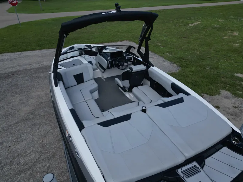 Slide: The Image of 2022 Malibu Wakesetter 20 VTX boat interior with sleek seating and modern design. - 7